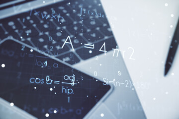 Creative scientific formula concept on modern laptop background. Multiexposure