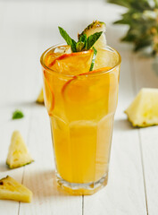 glass of juice，drink, juice, glass, fruit, orange, beverage, fresh, cocktail, food, healthy, ice, cold, citrus, lemon, yellow, refreshment, freshness, white, isolated, pineapple, sweet, alcohol, mango