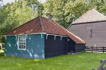 Old Dutch farmhouse with barn from the 1920s. In the traditional colors of West Friesland.