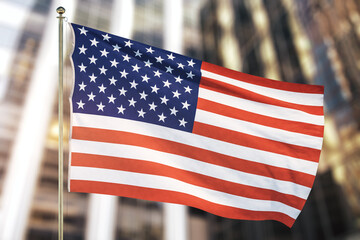 USA flag on blurry office building background, close up