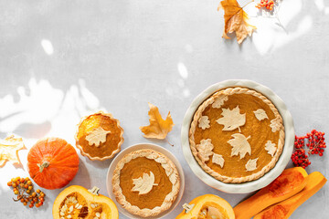 Sunny autumn day pumpkin pie baking at home concept