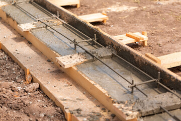 Lay of the cement or concrete into the foundation formwork with automatic pump