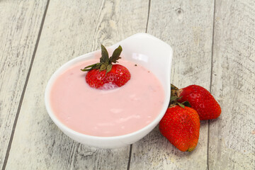 Yoghurt with strawberry in the bowl