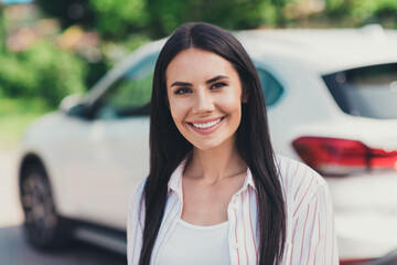 Close-up portrait of her she nice attractive pretty cheerful cheery lady lucky experienced driver new owner near white car credit debit loan buying vehicle motor summertime season