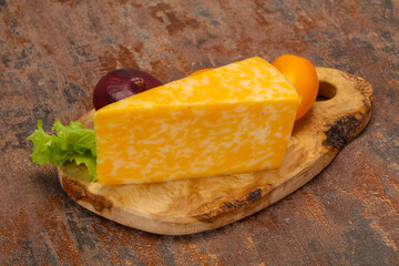 Marble cheese  triangle over wooden