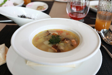 Bowl with smoked fish soup