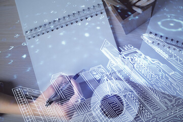 IOT drawing over writing hands in notepad background. Concept of smart home. Multi exposure