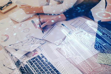 IOT drawing over writing hands in notepad background. Concept of smart home. Multi exposure