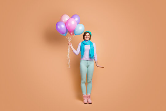 Full Length Body Size View Of Her She Nice Attractive Lovely Pretty Charming Glad Cheerful Cheery Girl Holding In Hands Bunch Air Balls Isolated Over Beige Pastel Color Background