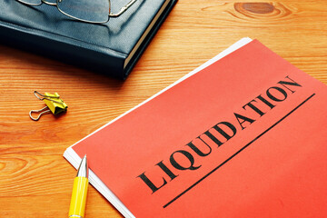 The word liquidation is printed on the red page. - obrazy, fototapety, plakaty