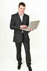 Young man in business suit with laptop