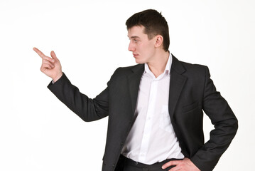 Young man in business suit points finger