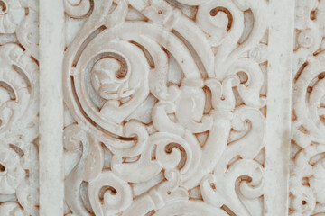 Close up shot of beautiful carving on wall of ancient hindu temple