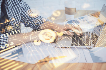 Technology theme hologram with man working on computer on background. High tech concept. Double exposure.