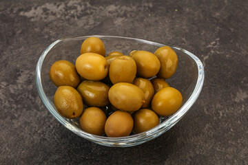 Green pickled olives in the bowl