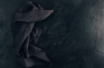 Elegant black table setting over black background.