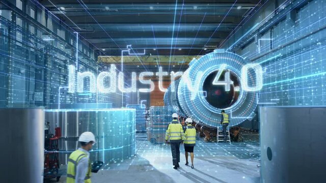 Futuristic Technology Concept: Team of Engineers and Professionals Workers in Heavy Industry Manufacturing Factory Digitalized with Graphics with Words Industry 4.0 Appearing. High-Tech Infrastructure