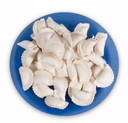 Frozen dumplings on a blue plate. Top view.