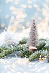 Christmas spruce with tree and blurred shiny lights.