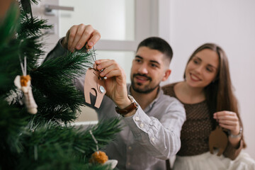 Happy caucasian couple celebrating new year at home