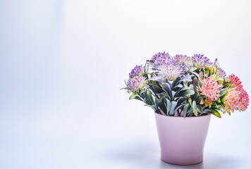 Colorful flowers bouquet in a vase on a gray background. Valentine card. Template greeting card for Valentine's Day. Spring card for Mother's Day or Women's Day. Greeting card with flowers, copy space