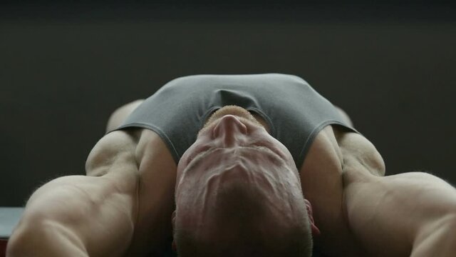 Fitness man doing chest workout in gym. Fitness and bodybuilding healthy concept. Caucasian bodybuilder doing exercises