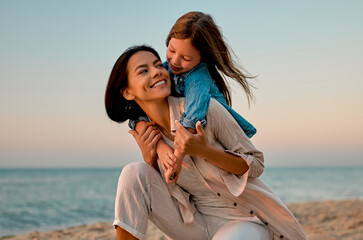 Mother with daughter on the beach