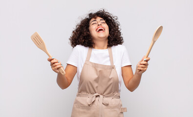 arab pretty woman chef wearing an apron.