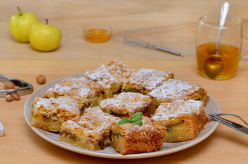 still life with homemade cakes sliced ​​pie on a plate and a cup of tea