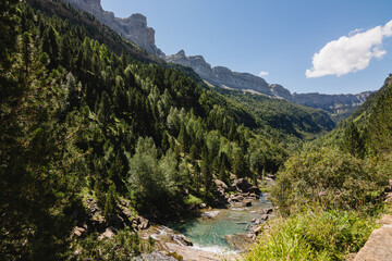 Fototapeta na wymiar River bed running through a mountain valley.
