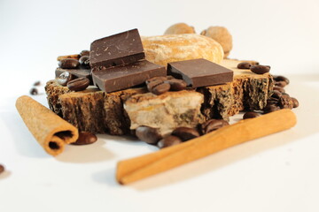 Coffee beans, cinnamon, round gingerbread, chocolate