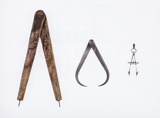 vintage mathematical compasses isolated on white background