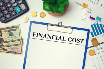 Paper with inscription Financial Cost on the table, calculator, money