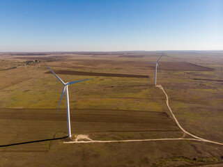windmills work in a summer field