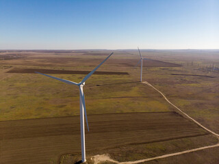 windmills work in a summer field