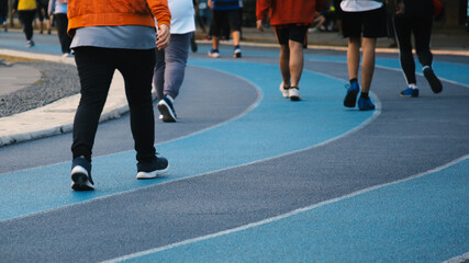 People feet, walking on the jogging track