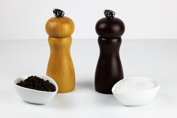 salt and pepper in white dip bowls