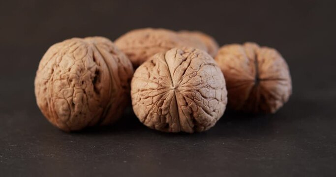 delicious and fresh walnuts on a black stone table