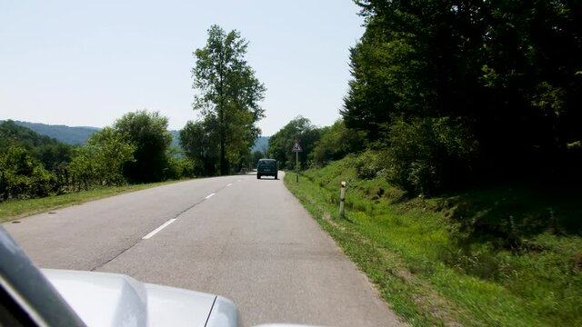 car pursuing a lada in a georgian countryside