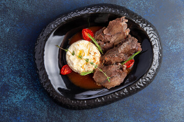 Chopped meat and mashed potatoes in a plate