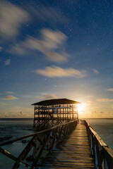 Moonrise at the Cloud 9 boardwalk and tower, Siargao island.