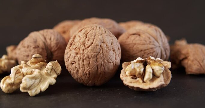 delicious and fresh walnuts on a black stone table