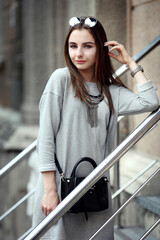 Portrait style of a woman on the street in sunny day with a beautiful spot scene of New York city at summer season