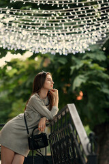 Portrait style of a woman on the street in sunny day with a beautiful spot scene of New York city at summer season