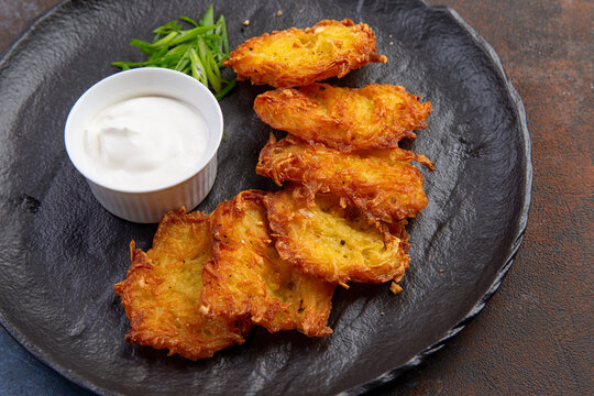 Potato pancakes dranik with sauce, a traditional Ukrainian dish