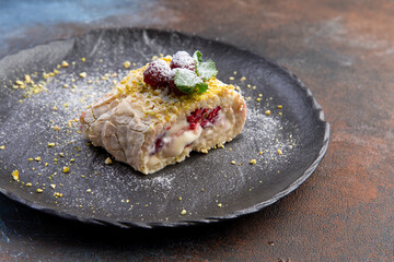 Meringue roll with cream, fresh berries