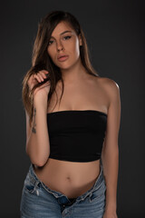 Girl posing on grey background. Studio Isolated