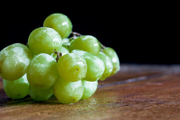Fresh organic grapes isolated on vintage table