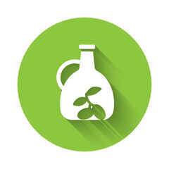 White Bottle of olive oil icon isolated with long shadow. Jug with olive oil icon. Green circle button. Vector.