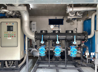 Pump rooms, pipes and valves in large industrial pumping stations